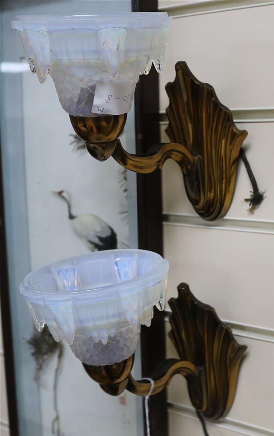 A pair of French Art Deco bronzed metal and opalescent glass wall lights, height 19cm